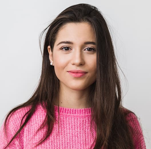 Young beautiful woman ping warm sweater natural look smiling portrait